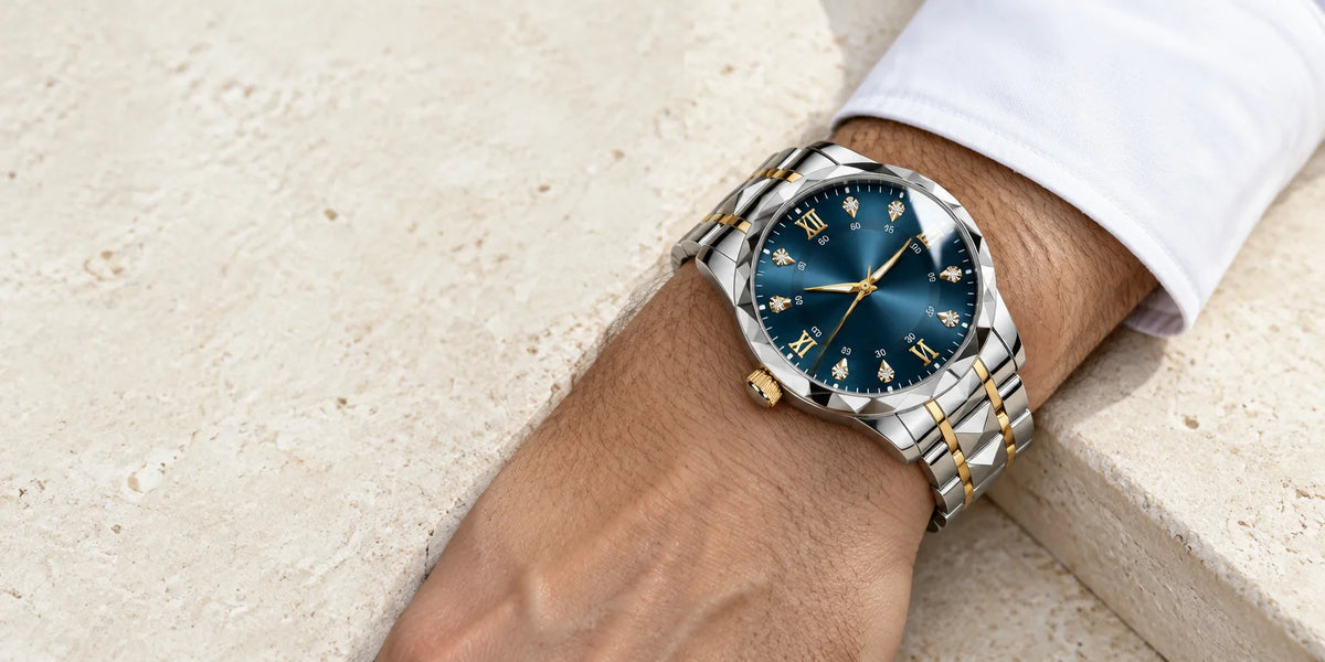 A close fashion photograph of the exact two-tone silver-and-gold steel bracelet watch with a deep bl